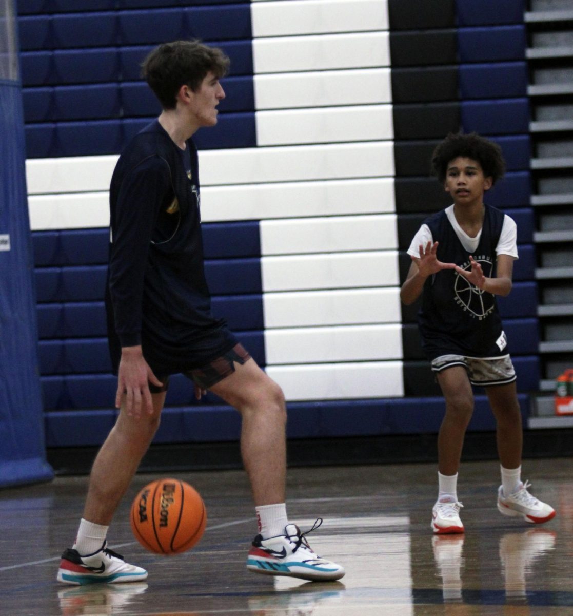 The JV Boys Basketball team is shown practicing before a game against William Monroe High School. Throughout these photos you can see these players hustling up and Down the court getting ready for their upcoming game. "One of the major things we spend some time on in practice are free throws because even if you miss just one, it can cost you the whole game", said John Lichti.  The Jv boys are working very hard as shown in the photos hoping to secure the victory in their upcoming game.#Bluestreakpride#HHSmediaLC