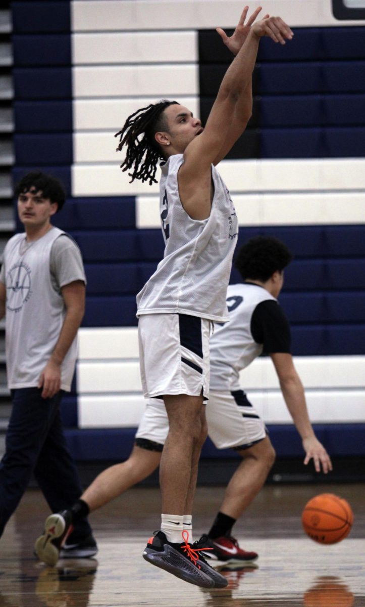 The HHS Varsity Boys Basketball team is shown practicing free throws, a shooting drill and running plays before there game. Sophomore Yandel Robles was nominated earlier this week for 1st team all valley district. "I'm so grateful for all of my friends and family members support this season. I feel like we could've done better, but it was a good season" Yandel Robles said.