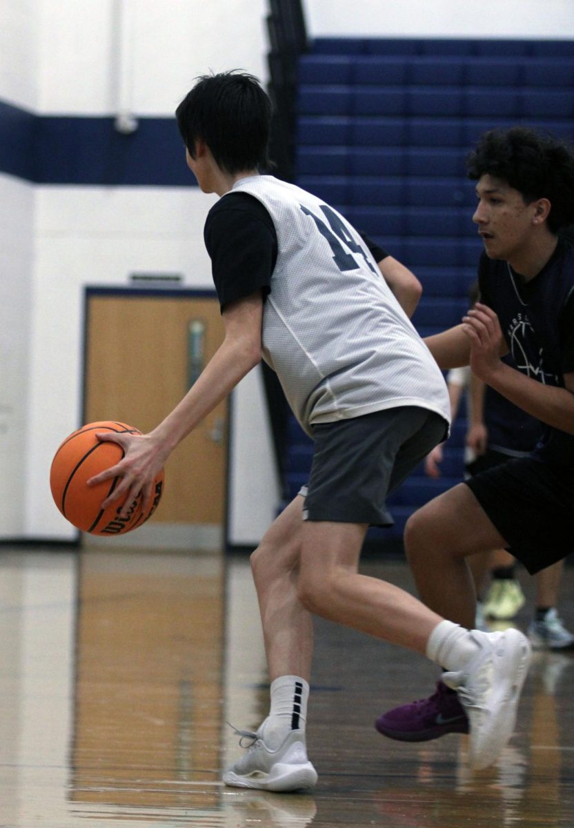 The JV Boys Basketball team is shown practicing before a game against William Monroe High School. Throughout these photos you can see these players hustling up and Down the court getting ready for their upcoming game. "One of the major things we spend some time on in practice are free throws because even if you miss just one, it can cost you the whole game", said John Lichti.  The Jv boys are working very hard as shown in the photos hoping to secure the victory in their upcoming game.#Bluestreakpride#HHSmediaLC