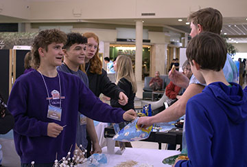 Sophomore Wesley Swartz holding a bag of marshmallows.