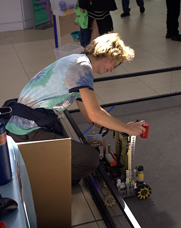 Lewis Johnson tinkering with his robot.