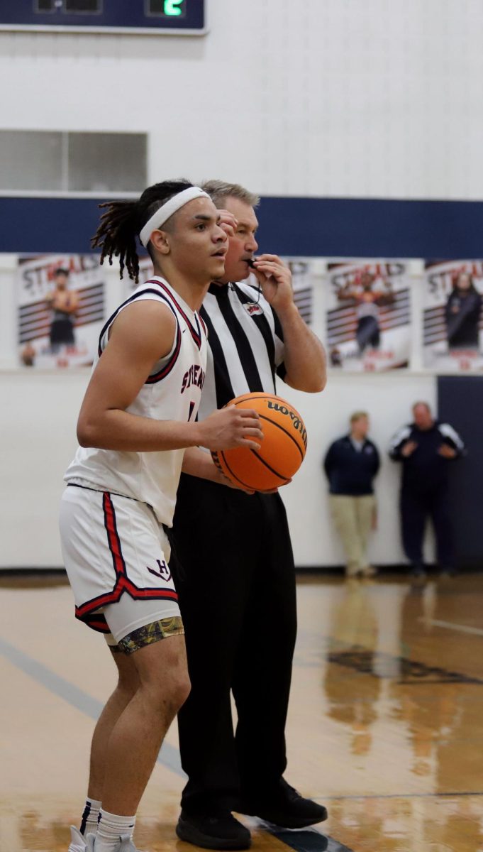 Senior Lazaro Valdivia holding the ball 