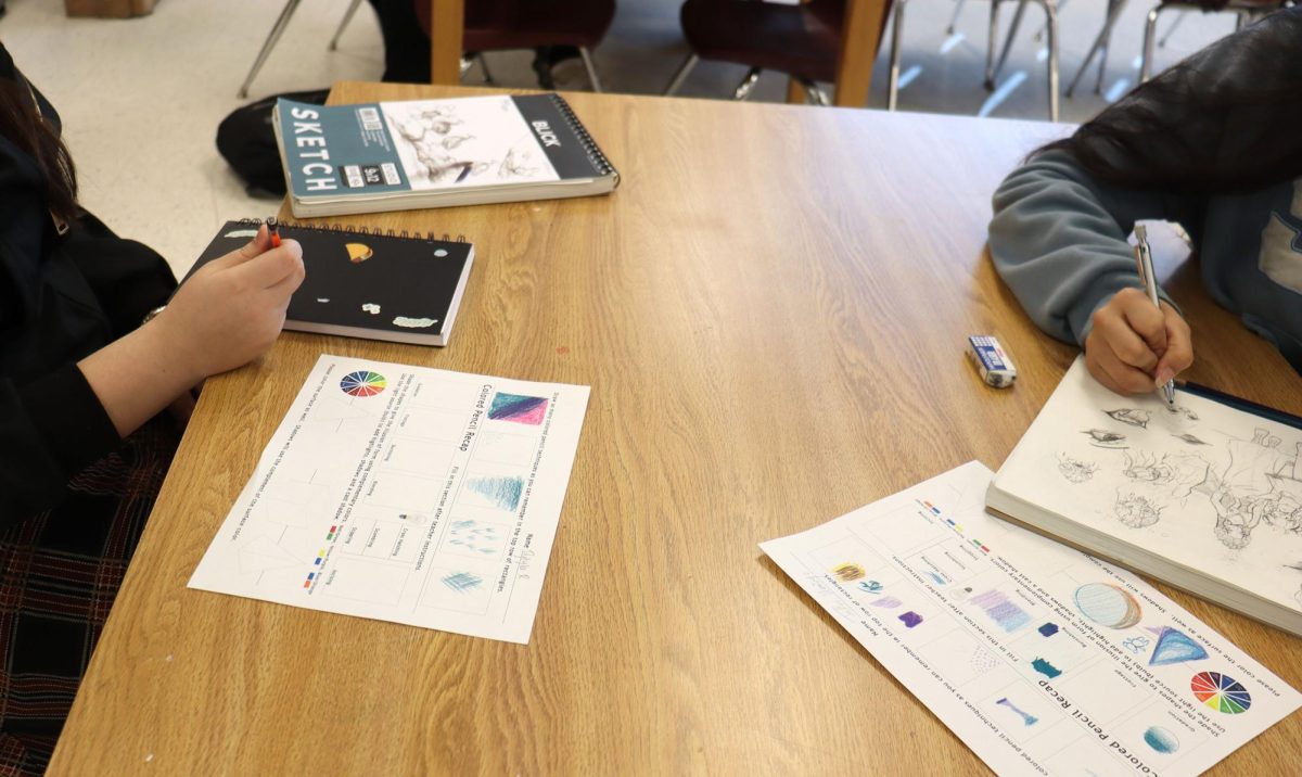 Students are focused on their sketchpads, pencil tips moving with eagerness as they bring their ideas to life. A class time of practice and dedication has led them to this moment, each one perfecting their technique and exploring new styles.