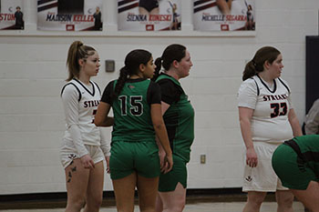 Despite being tired, all the girls are giving it their all to win the game.
