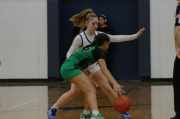 Sophomore Sierra Cain is preventing the other team from scoring a point.