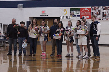 The senior girls all have their families at the game one last time.