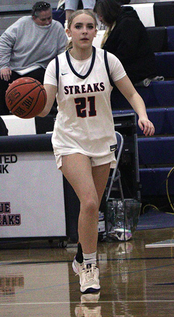 Leah Crawford practices dribbling.