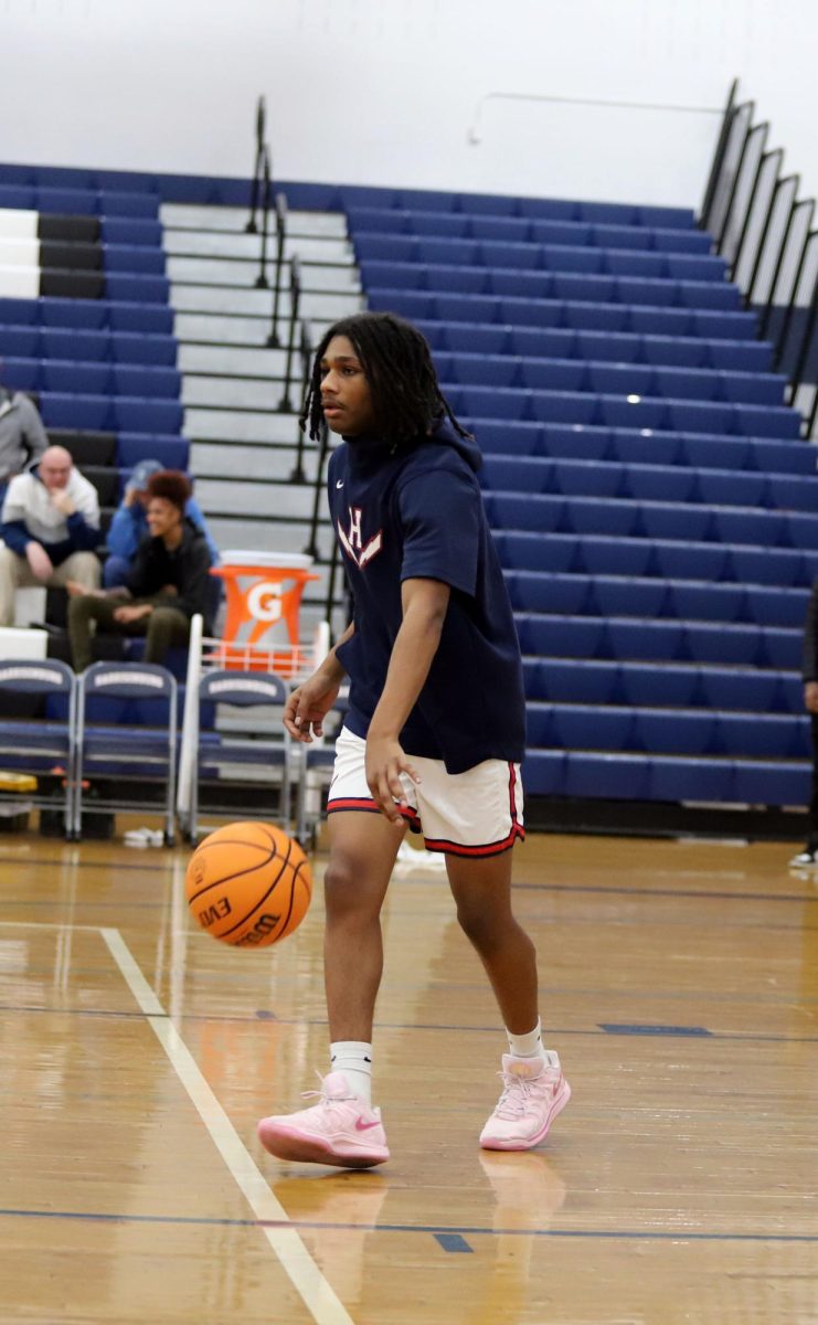 Sophomore Qwanell Franklin-Fry dribbling the ball.  