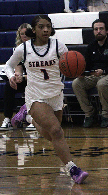 Alyse Sheffey takes the ball all the way to the hoop.