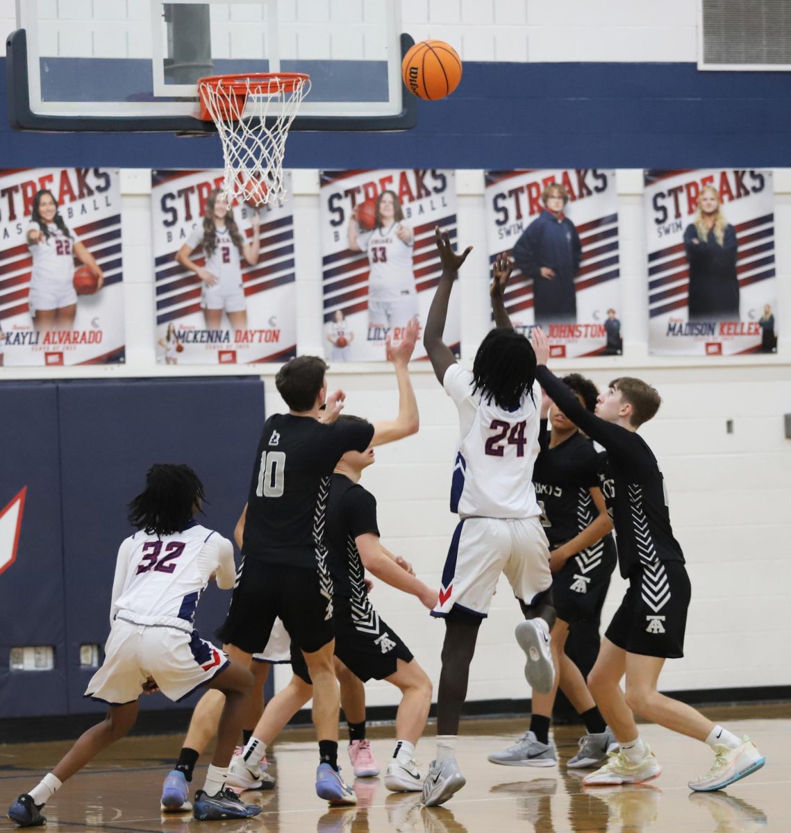 Sophomore Fred Ndunguste Shooting the ball
