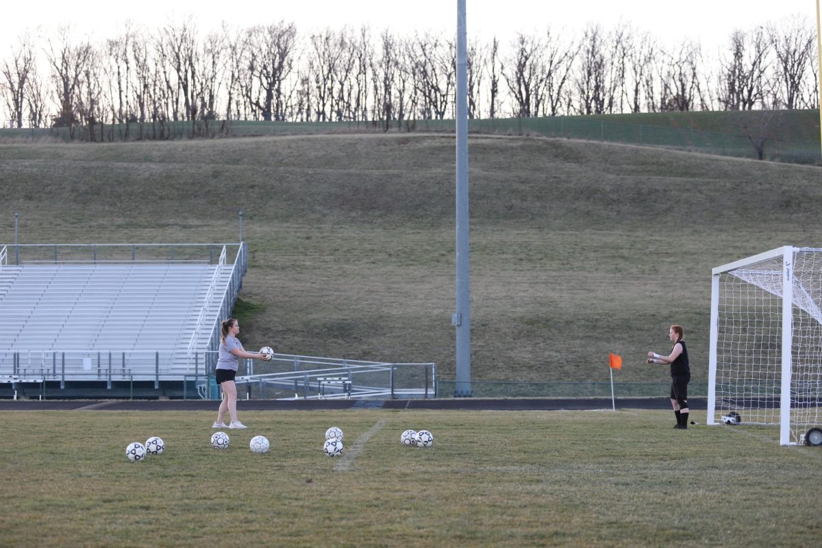 Sophomore Ava Colley practices blocking the ball.
