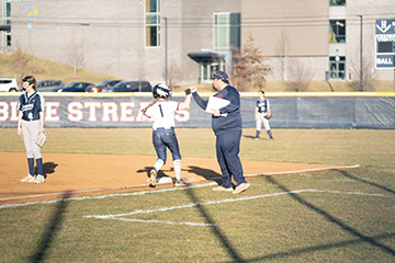 addie Campbell high five coach