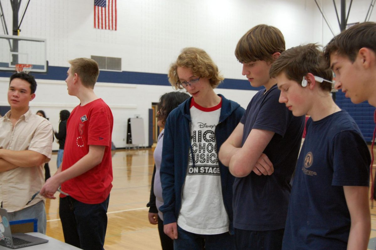 Sophomore Lewis Johnson and friends attempt activity.