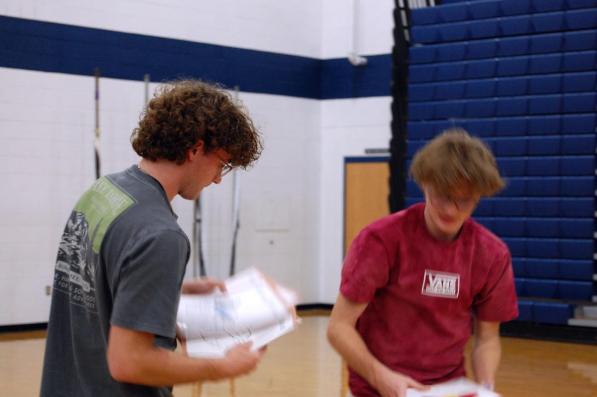 Seniors Davis Bert and Peter Johnston reset memory game.