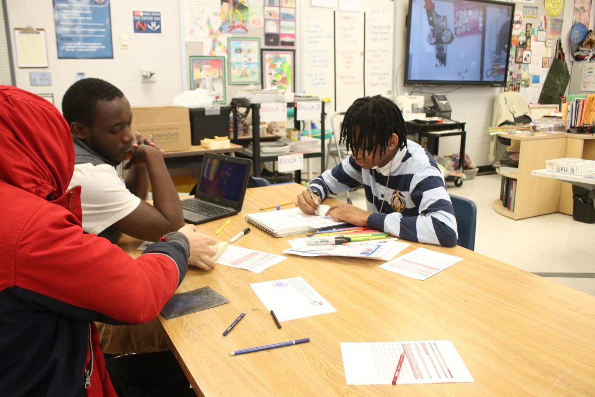 Students talking and making art 