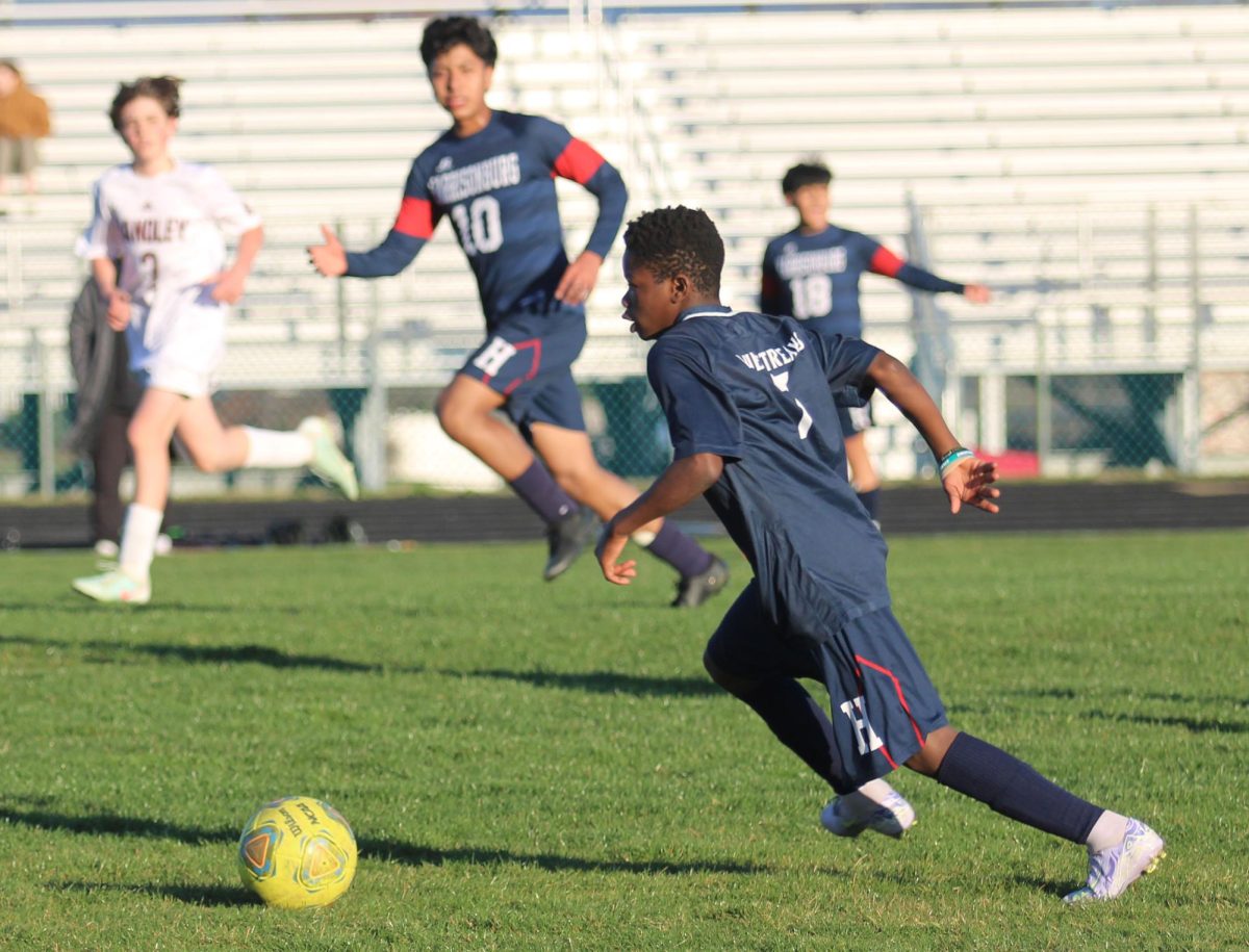 Eighth grader Augustin Kalenga runs to the ball.