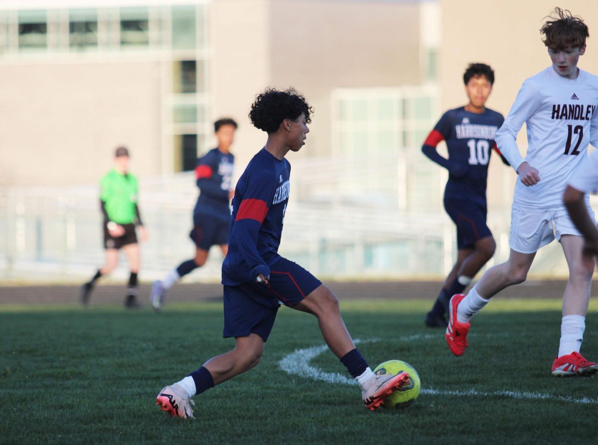 Eighth grader Michael Hernandez Castro dribbles the ball to the goal.