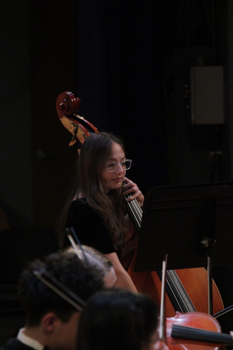 Ava Thompson playing the bass.