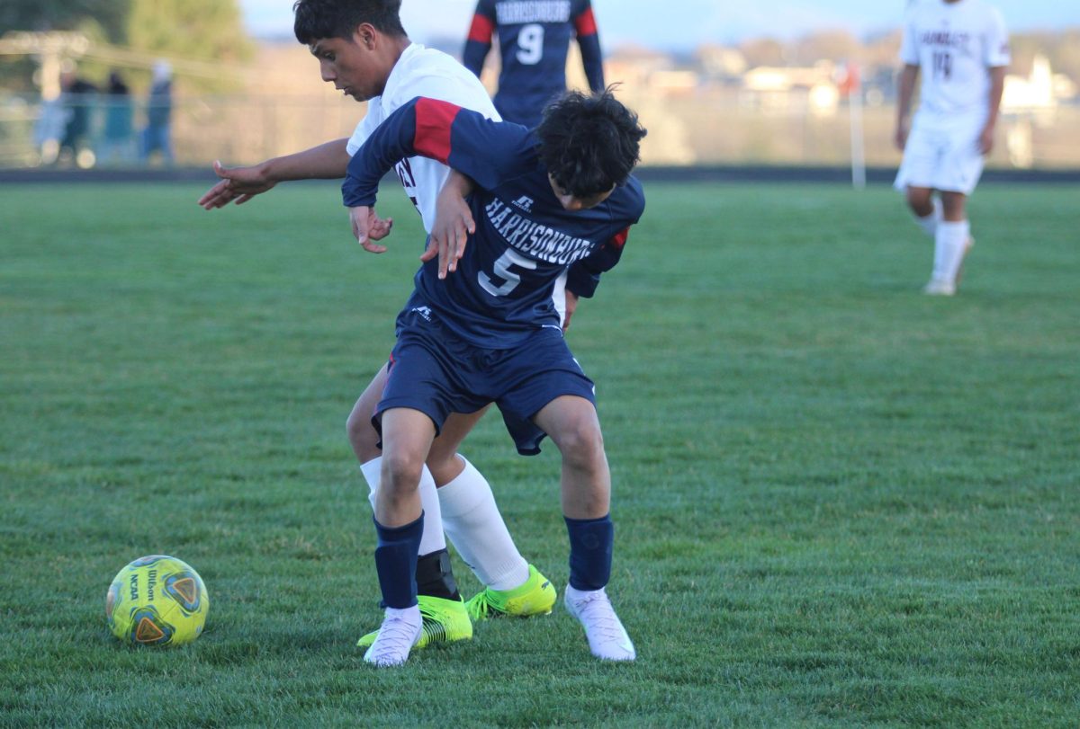 Freshman Jose Garcia Machado defends John Handley player.