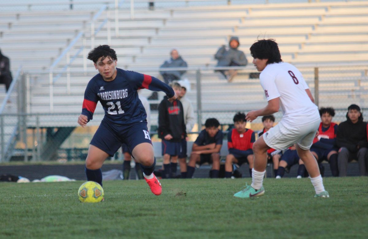 Sophomore Jeferson Rivera Mazariegos runs up to kick the ball.
