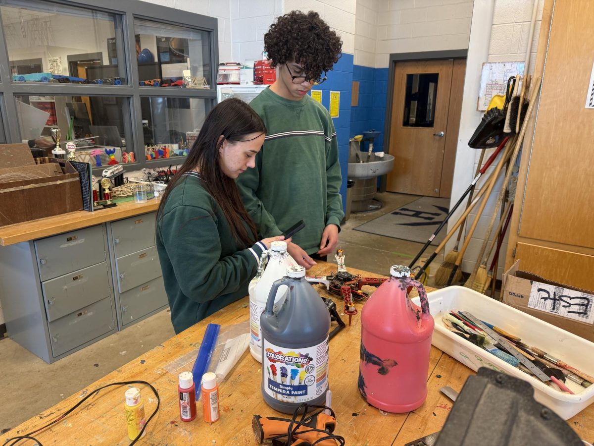 teammates work on one of the projects