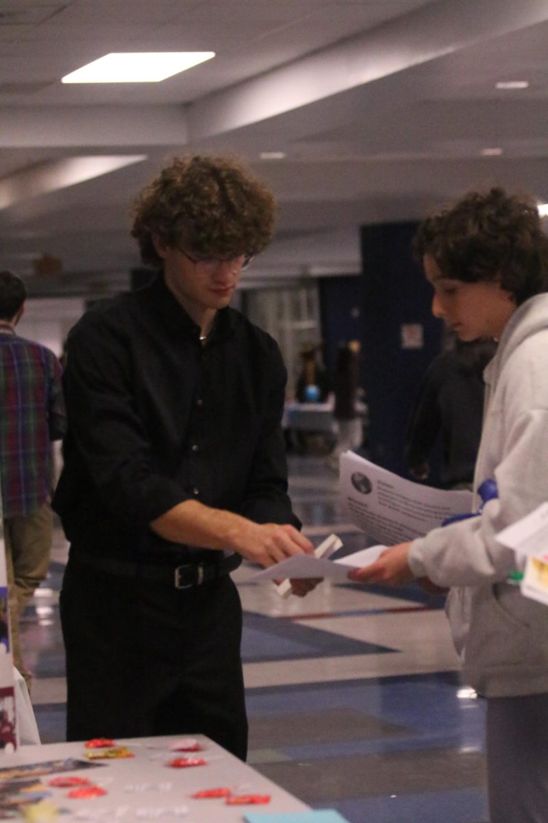 Davis Bert helping an 8th grader.