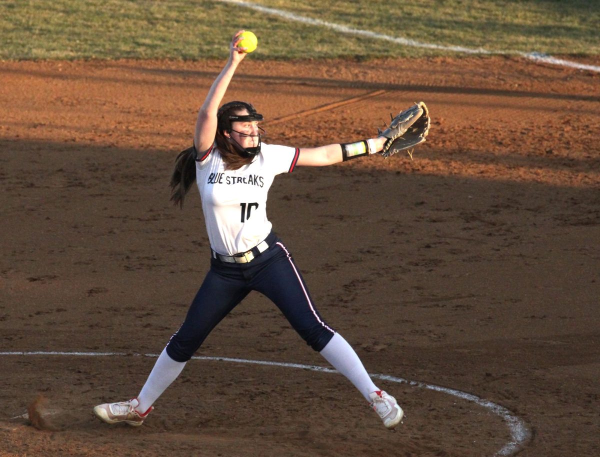 Freshman Delaynee Dayton pitches the ball.