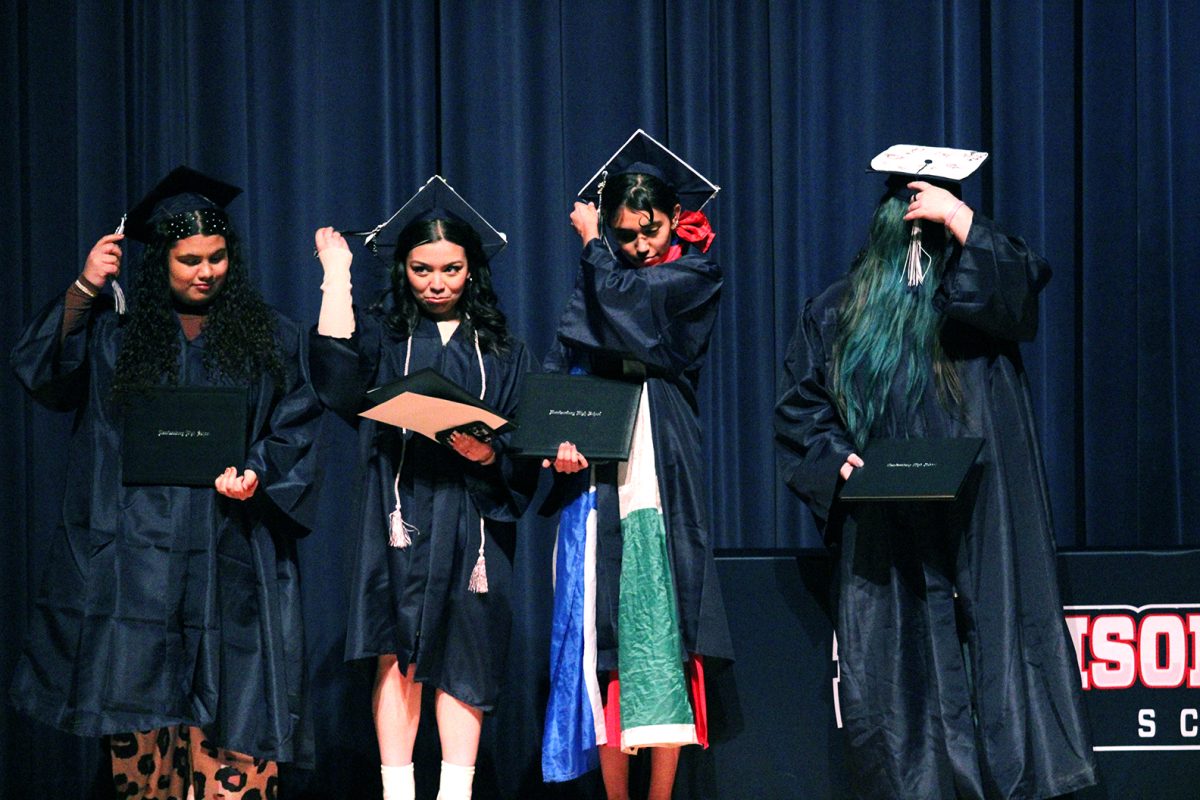 Graduates flip their tassel.