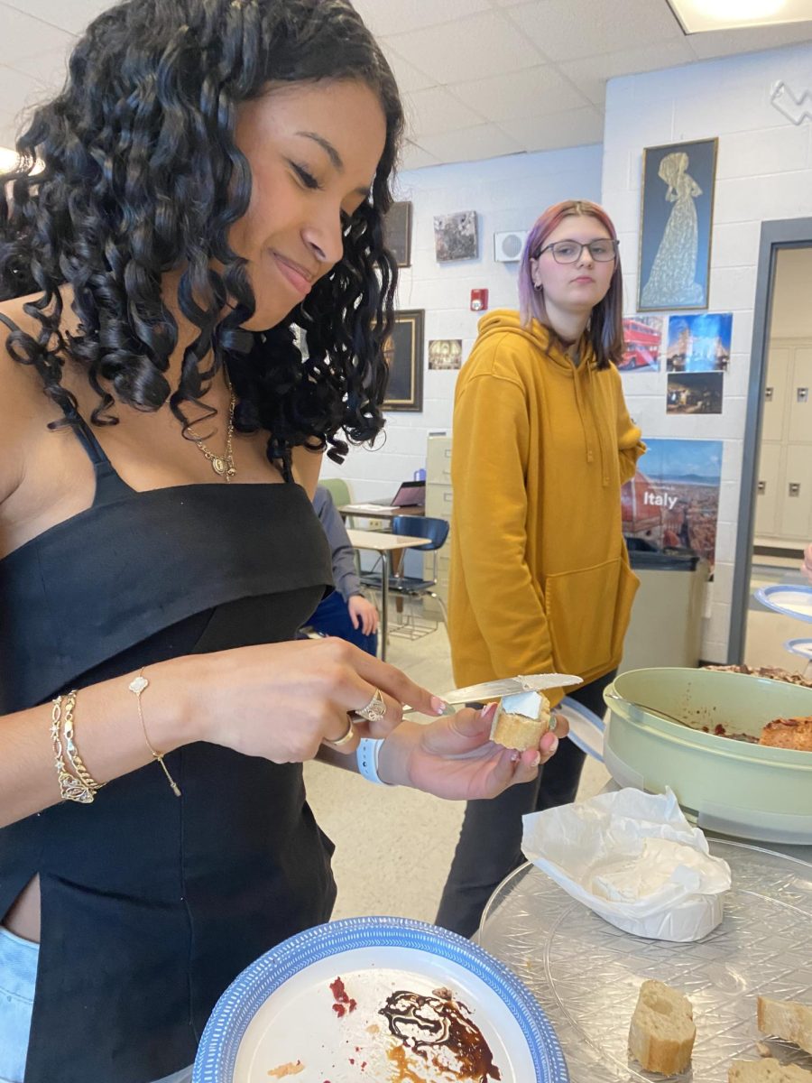 Sophomore Kaycee Tronco-Cordon and Junior Keira Miller get food.