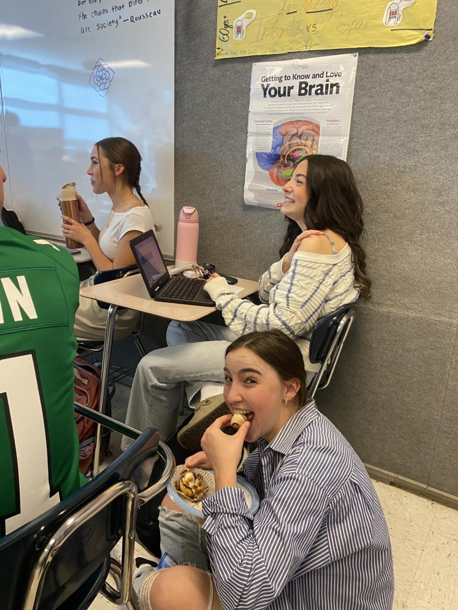 Junior Annie Snow takes a bite of delicious food.