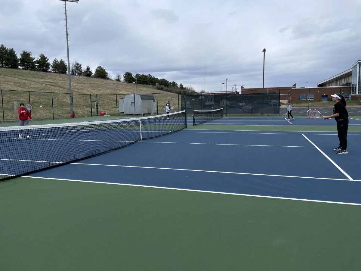 Students warm up by playing short court. 