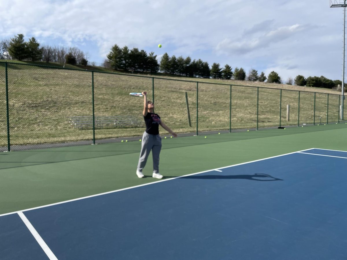 Freshman Brianna Aceituna serves the ball. 