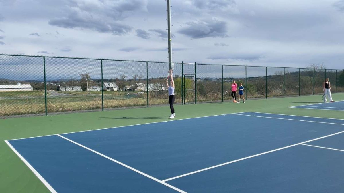 Sophomore Nora Von Rotz goes in to serve the ball. 