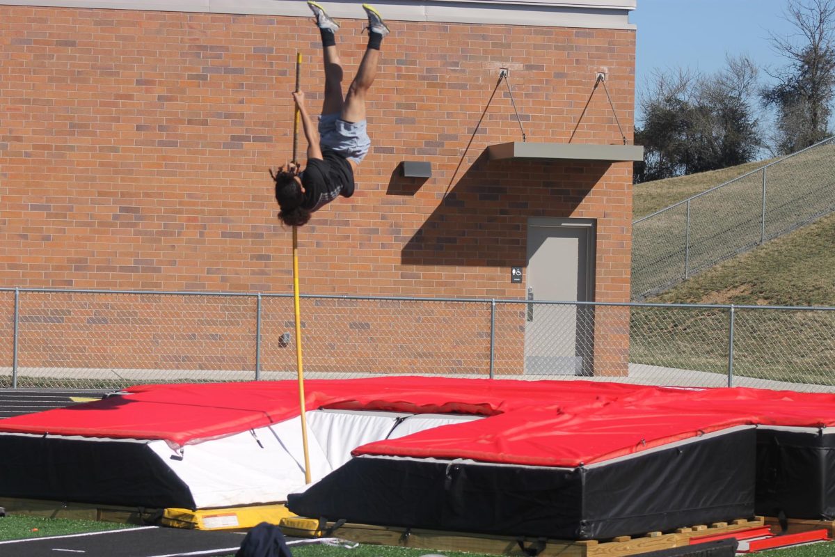 Senior track athlete Dominique practicing pole vault.