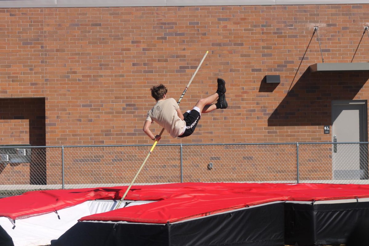 Track athlete practicing pole vault