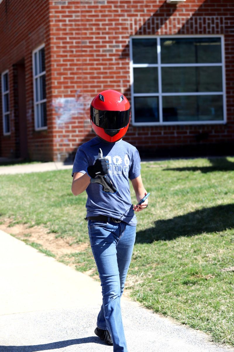 Sophomore Eliel Cortina walks to the car, looking suave.