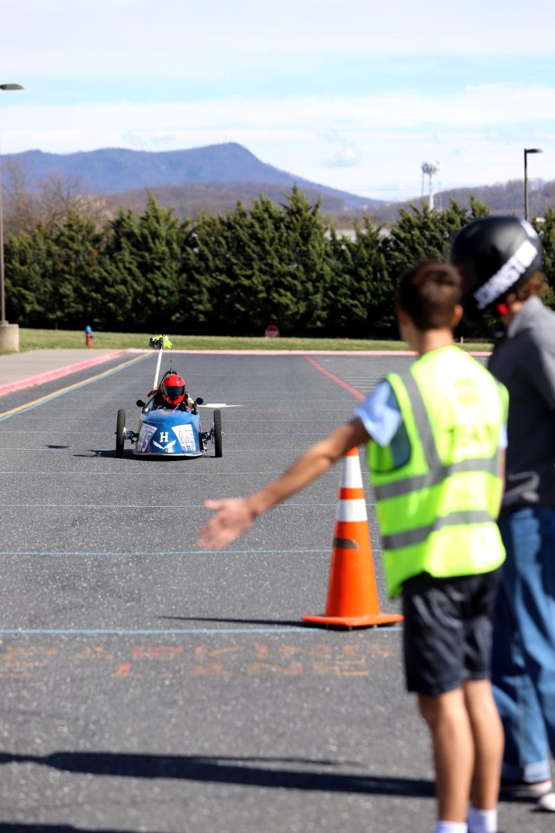 Sophomore Josiah Nafziger waves Eliel Cortina in to swap drivers.