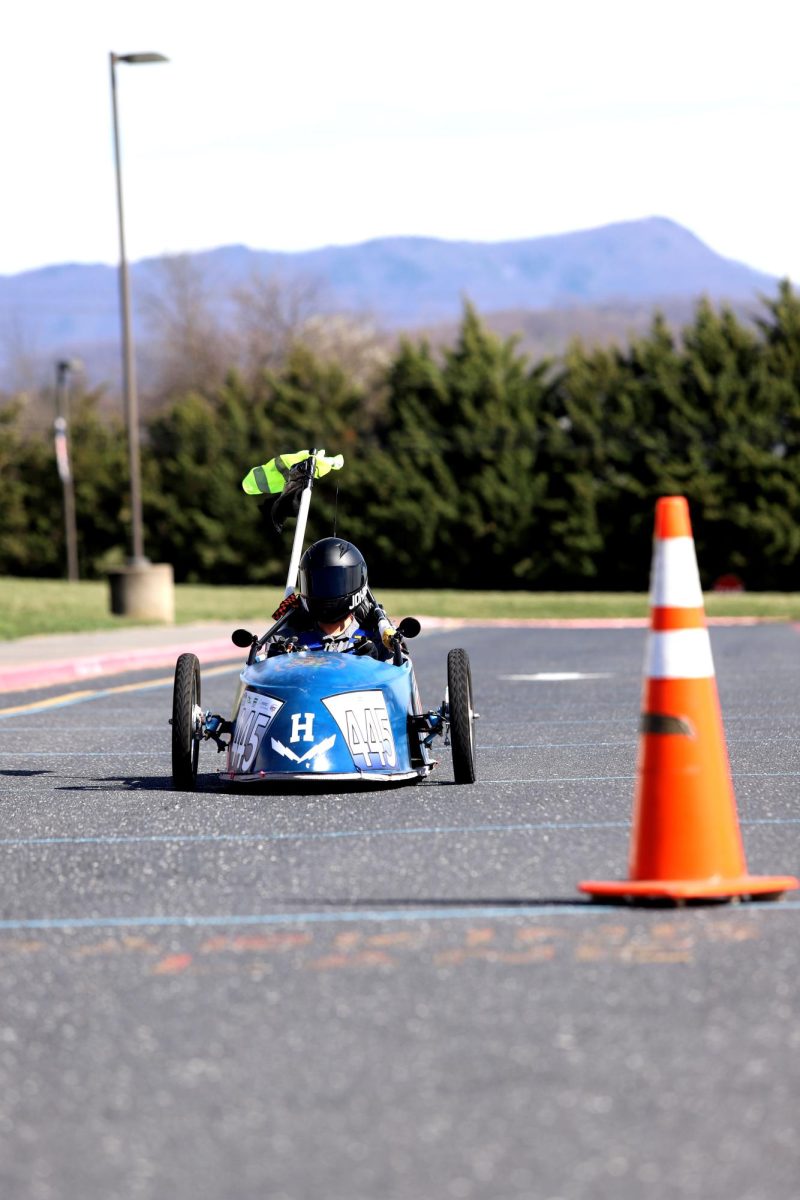 Senior Davis Bert drives down the straight-way.