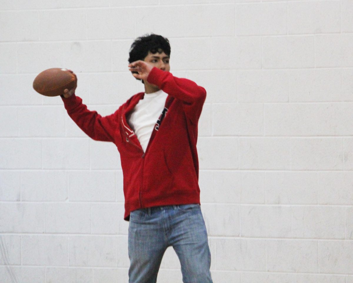 Freshman Alfredo Rivero-Rodriguez throws the football