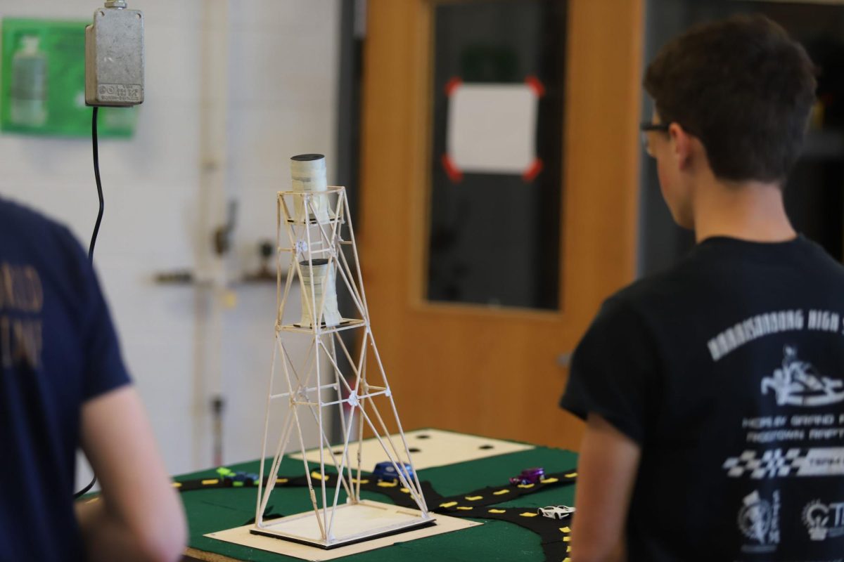Sophomore Josiah Nafziger watches as his team's tower withstands the largest amount of weight out of the class.