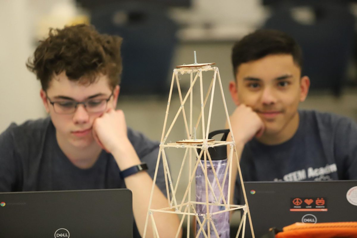Sophomores Samuel Walton (left) and Elio Cortina (right) finish their project poster after collecting all the data from tower testing.