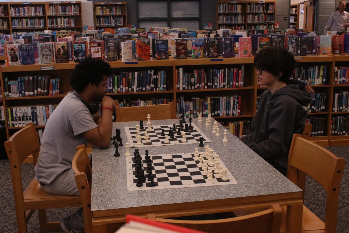 Students playing chess during lunch.