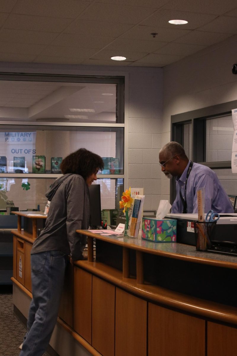 Senior Aiyana Thornton checking out abook during lunch.