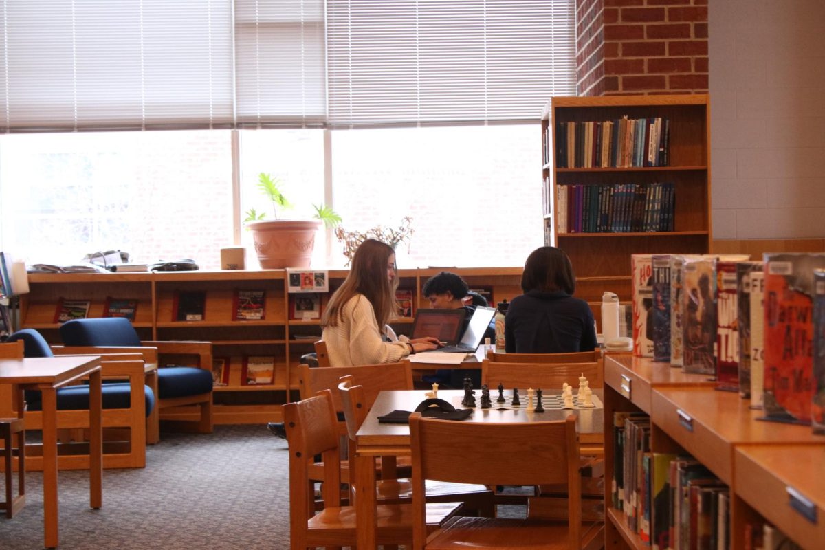 Students doing homework in the library during lunch