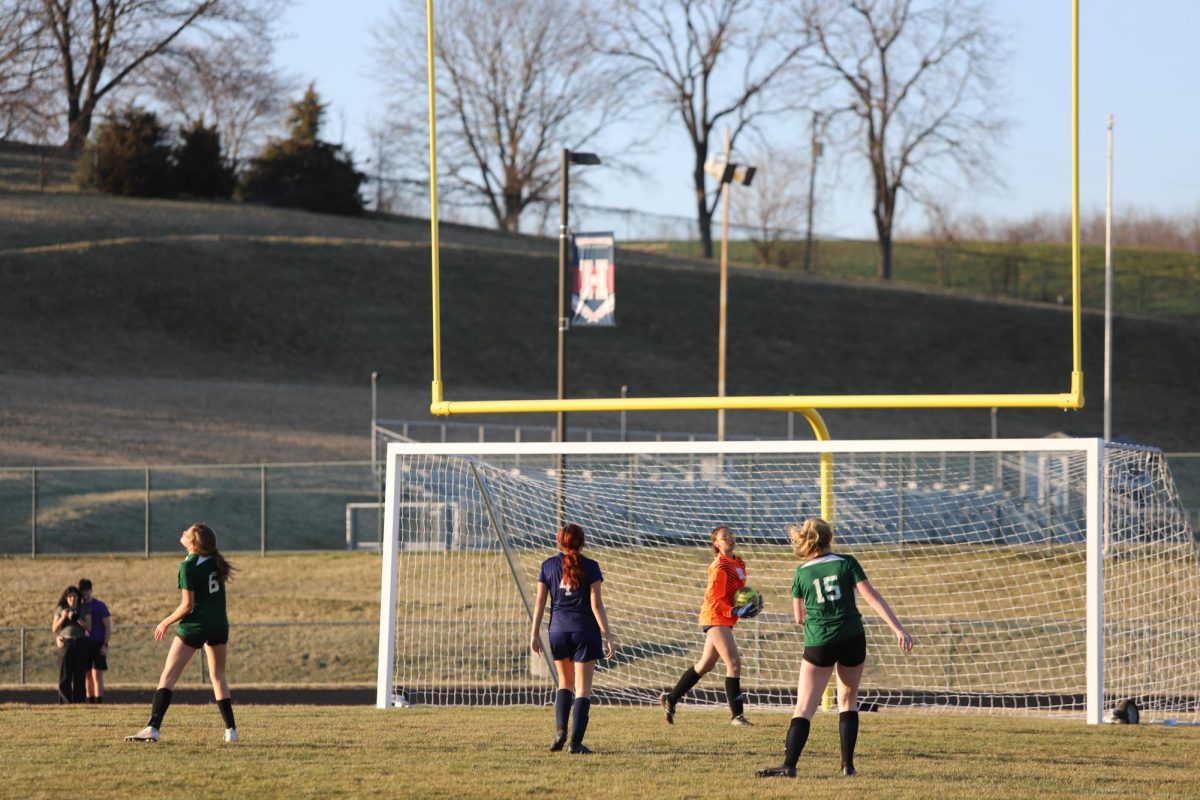 Freshman Lucy Hunter defends the goal.