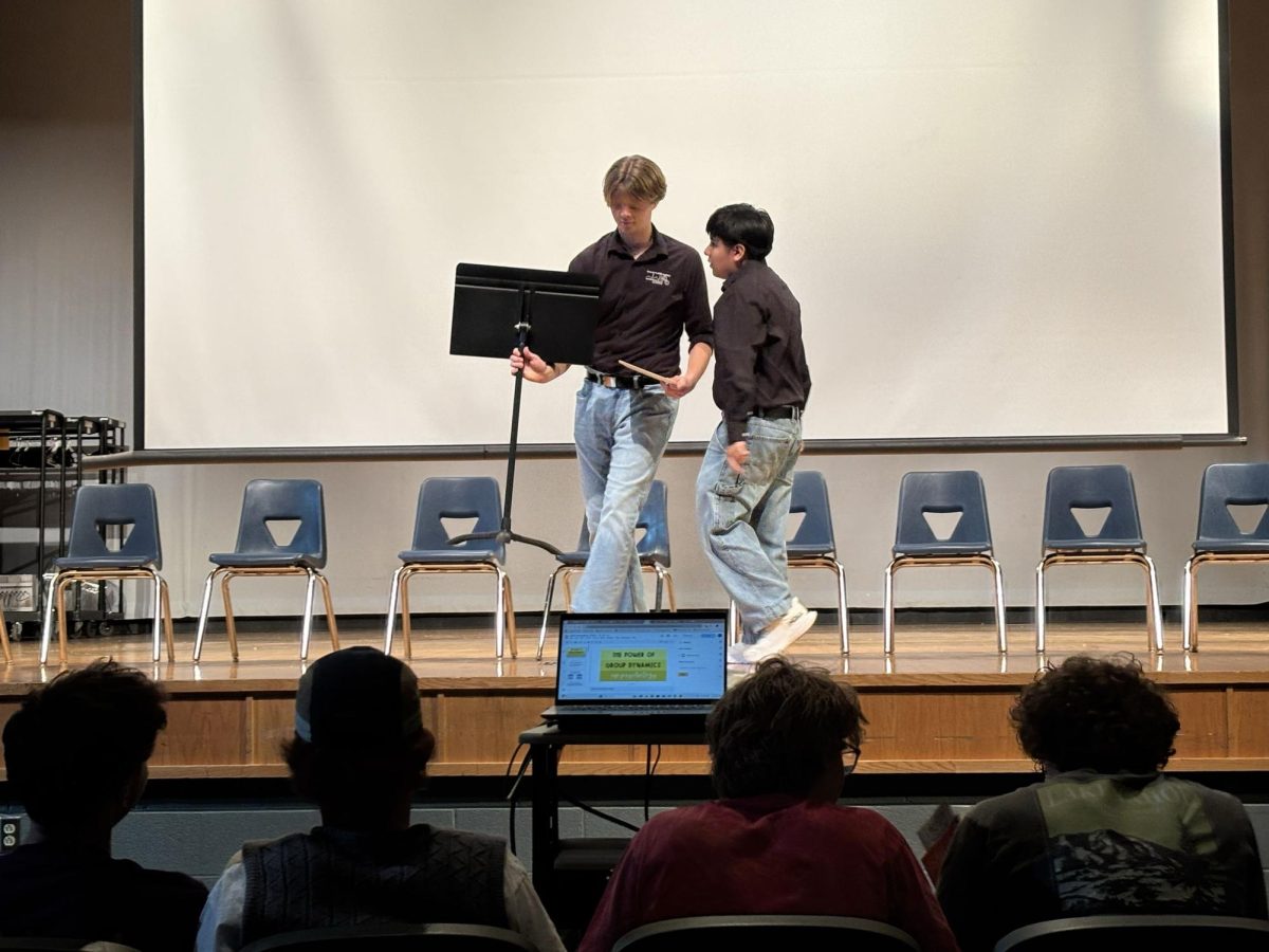 HHS STEM board members Gio Sanchez and Drew Lankford getting the stage ready.