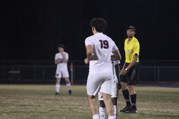 Senior Rayyan Garout runs on to the field during a substitution.