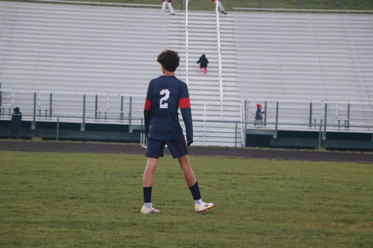 Joel Metzler standing on the field.