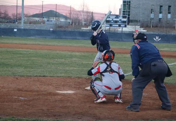 Sophomore Shea Gibson prepares to hit the ball