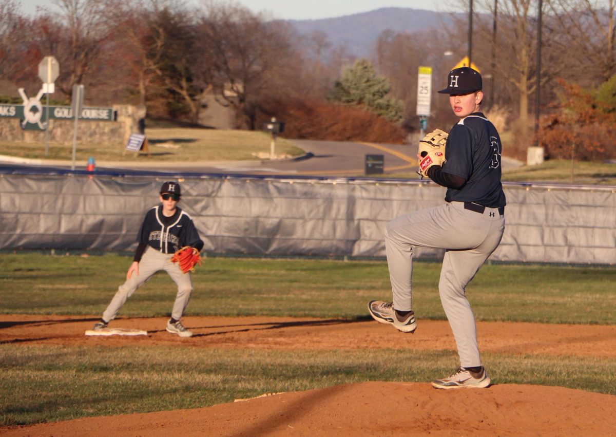 Eighth grader Andrew Noll pitches